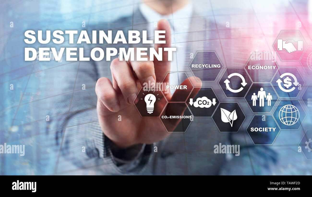 Sustainable development, ecology and environment protection concept. Renewable energy and natural resources. Double exposure of success businessman Stock Photo