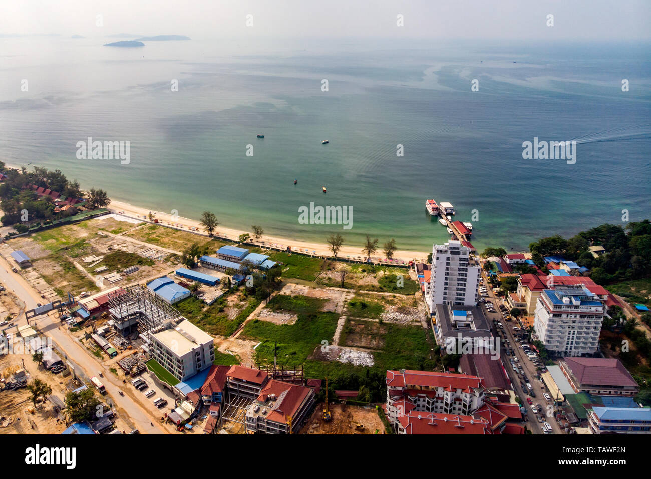 Top view of the wasteland by the sea and buildings under construction in Sihanoukville, Cambodia Stock Photo