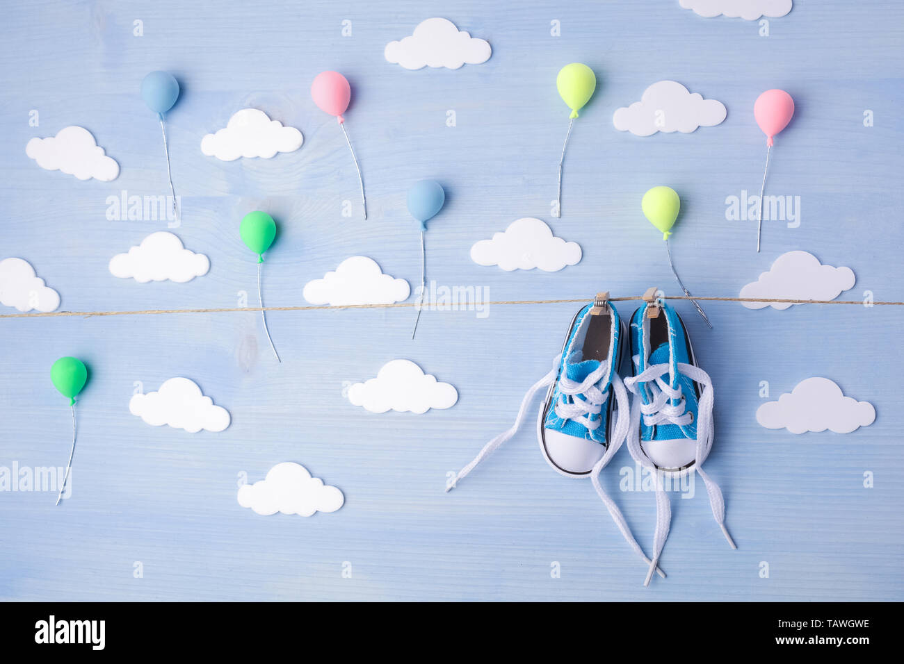 Baby Background With Balloons White Clouds And Baby Boy Shoes On Blue Wooden Background Stock Photo Alamy