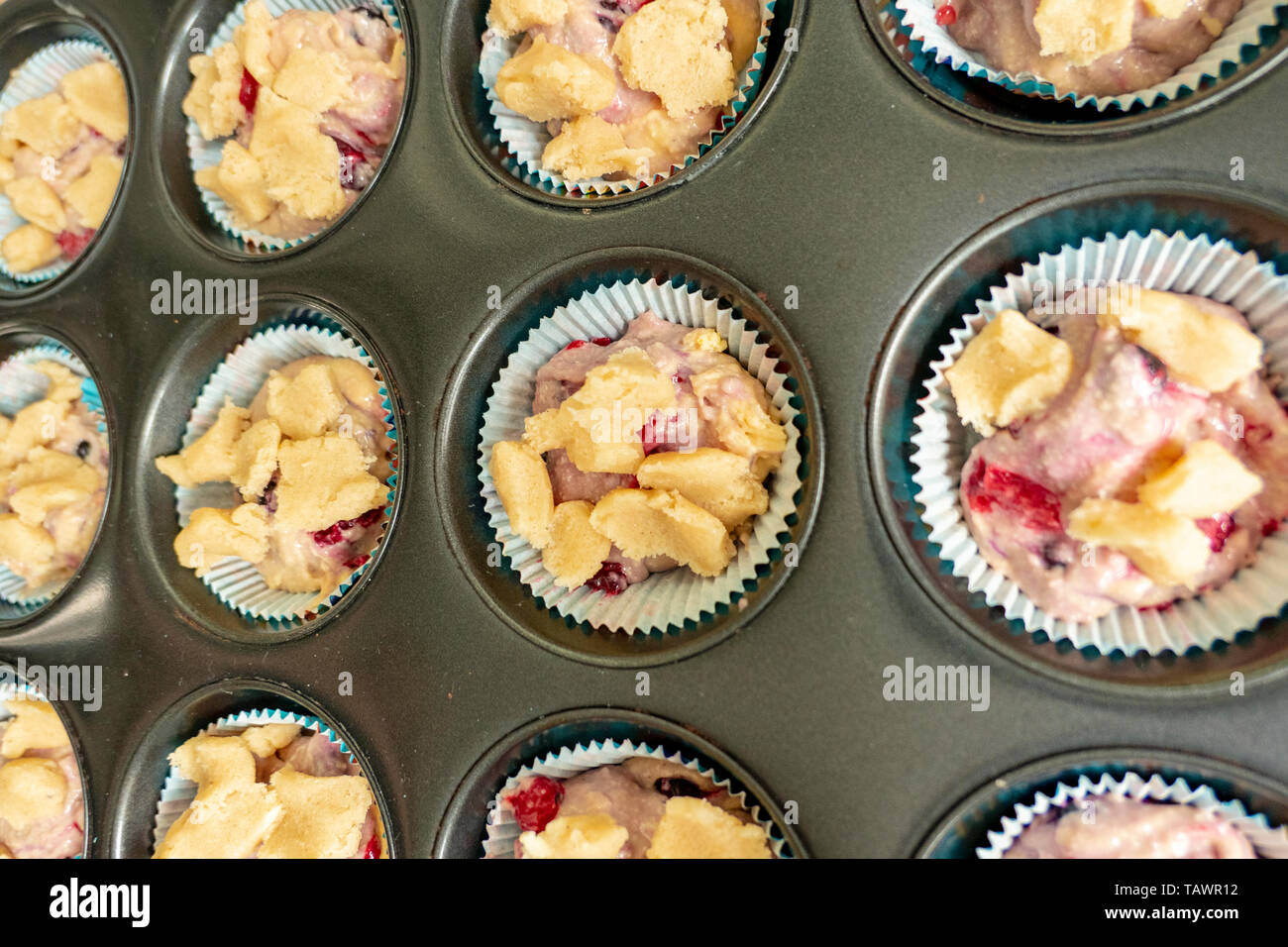 raw muffin dough with crumble before baking Stock Photo