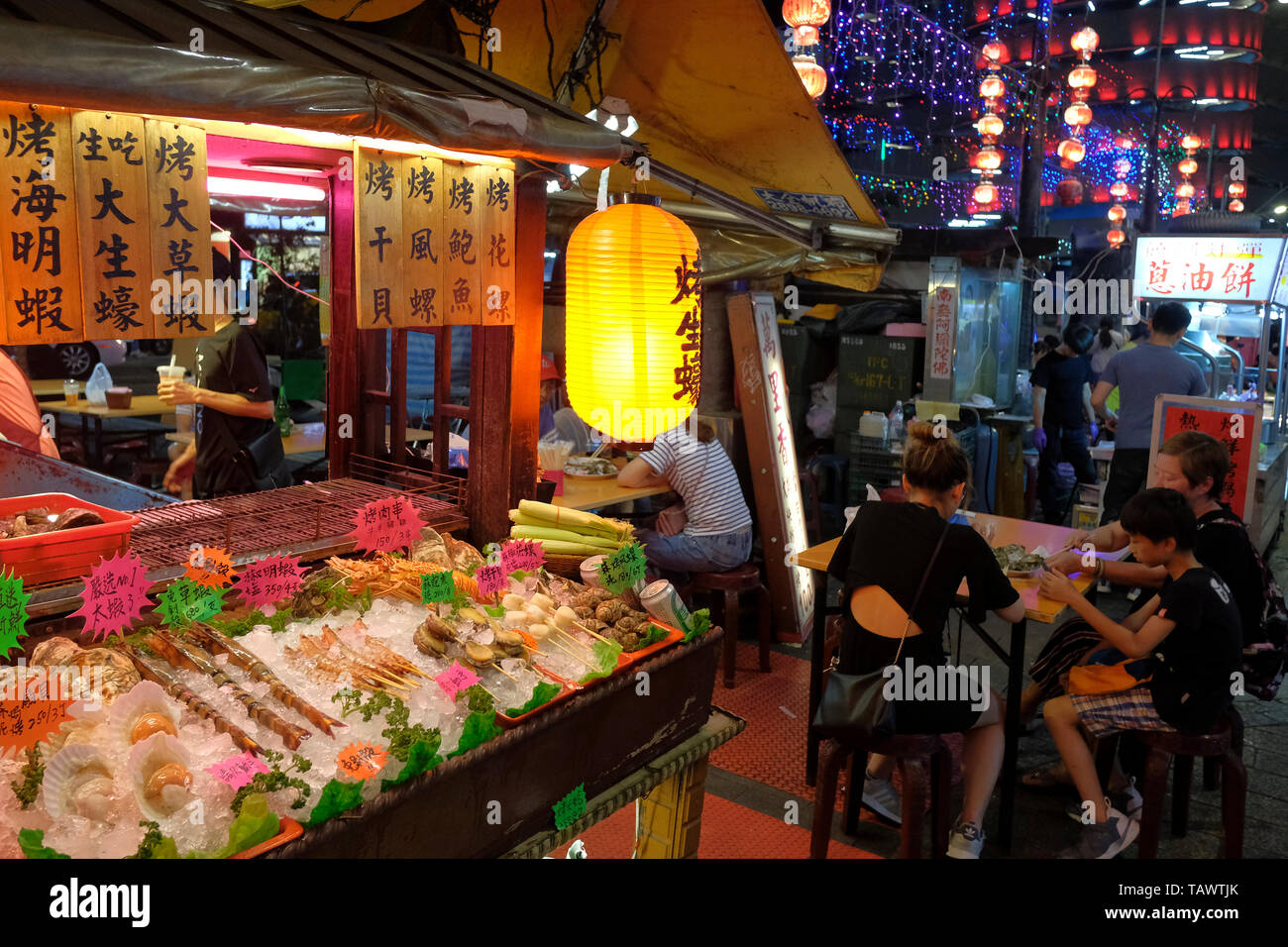 Food stall at Raohe Street Night Market one of the oldest night markets in Songshan District, Taipei, Taiwan. Stock Photo