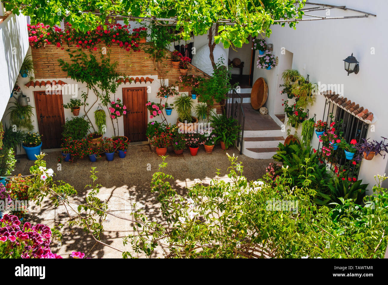 Typical Andalusian patio with flowers. Casa Ethnographic Museum, Mijas Pueblo. Malaga province, Costa del Sol. Andalusia, Spain Europe Stock Photo