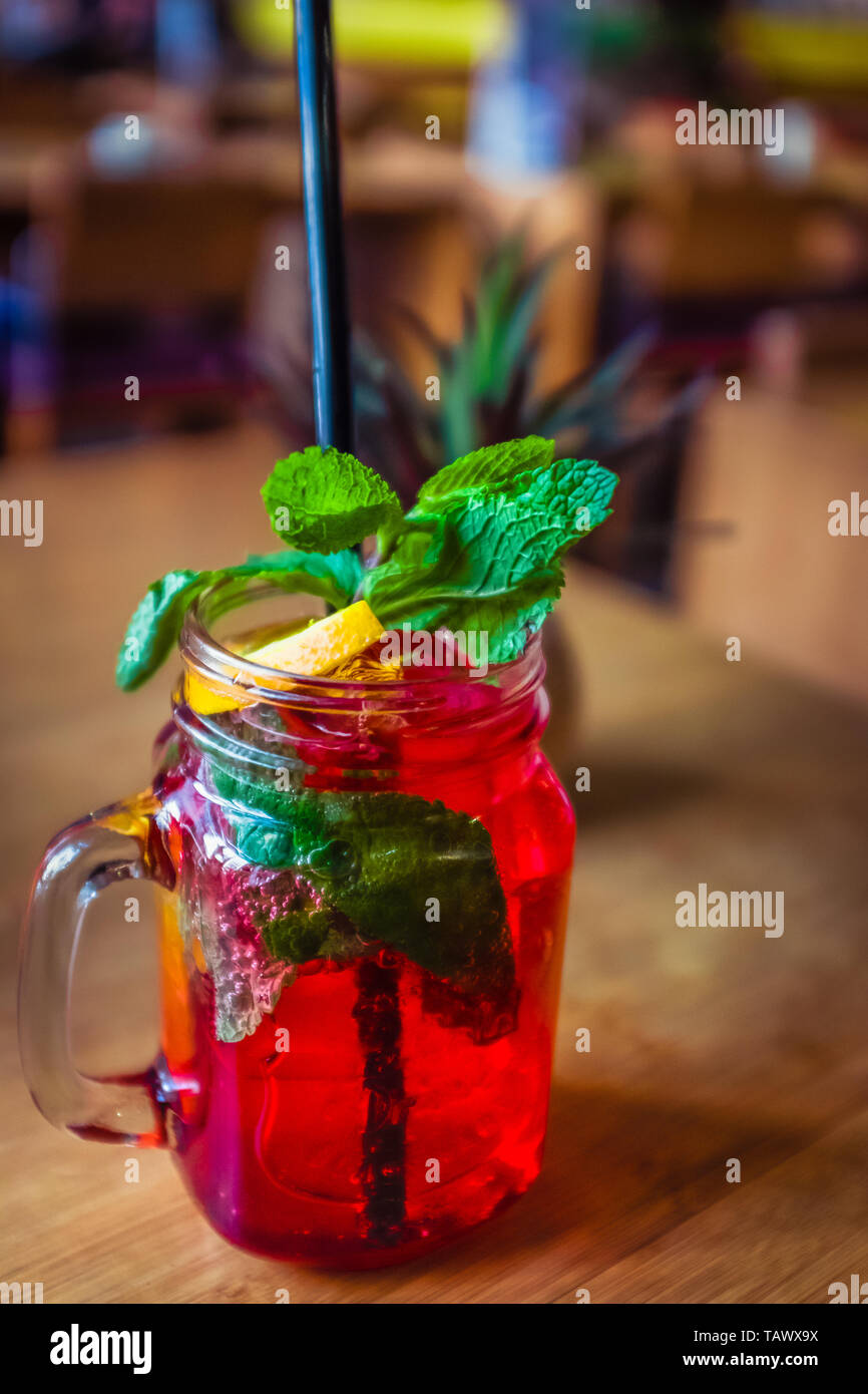 Raspberry Mocktail With Fresh Raspberries  and Mint and Lemon Garnish Stock Photo