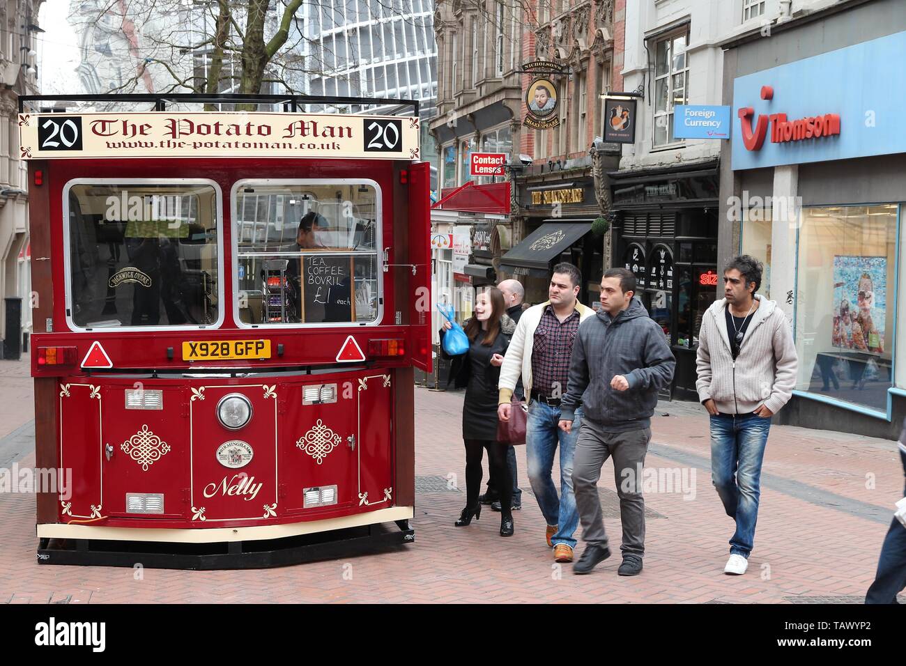 BIRMINGHAM, UK APRIL 19, 2013 People walk by Potato Man traditional