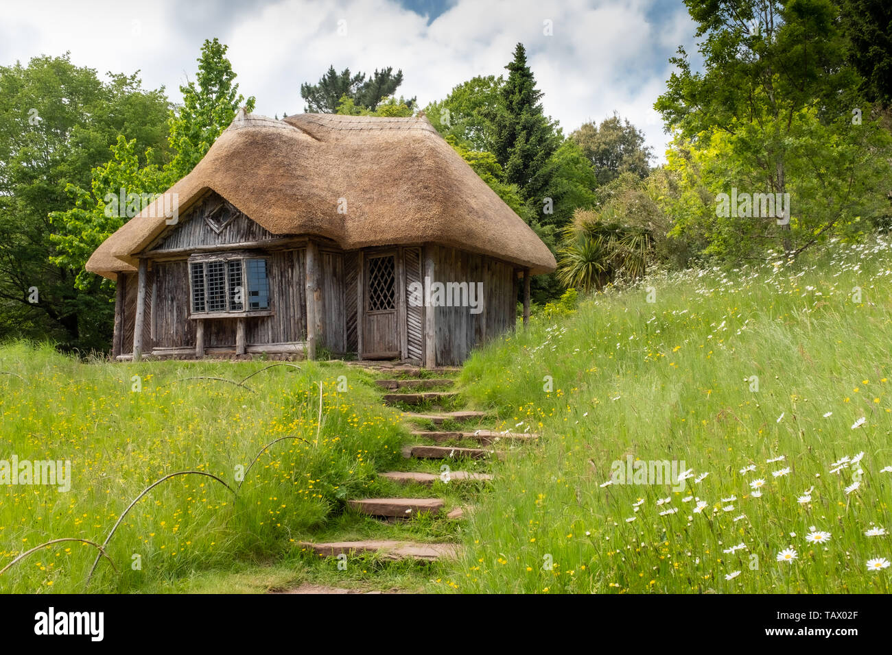 The Bear’s Hut, old thatched garden building, Killerton Estate, National Trust, Devon, UK Stock Photo