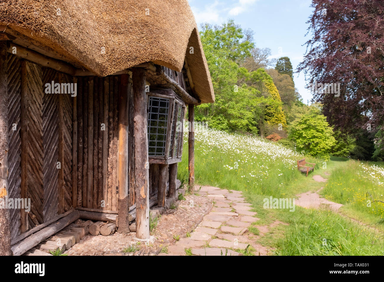 The Bear’s Hut, old thatched garden building, Killerton Estate, National Trust, Devon, UK Stock Photo