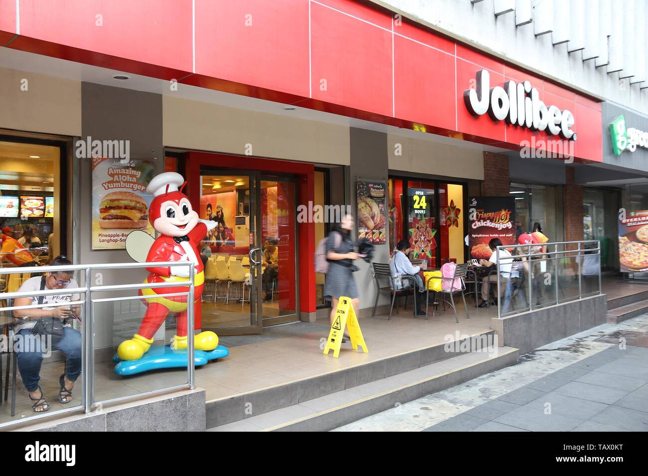 MANILA, PHILIPPINES DECEMBER 7, 2017 People visit Jollibee fast food