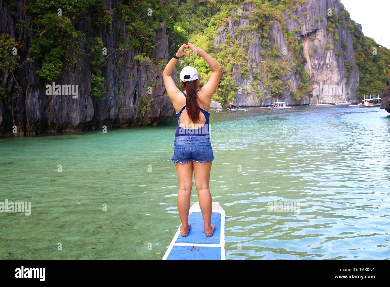 PALAWAN, PHILIPPINES - DECEMBER 1, 2017: Tourist enjoys island hopping tour in Palawan, Philippines. 6 million foreign tourists visited Philippines in Stock Photo