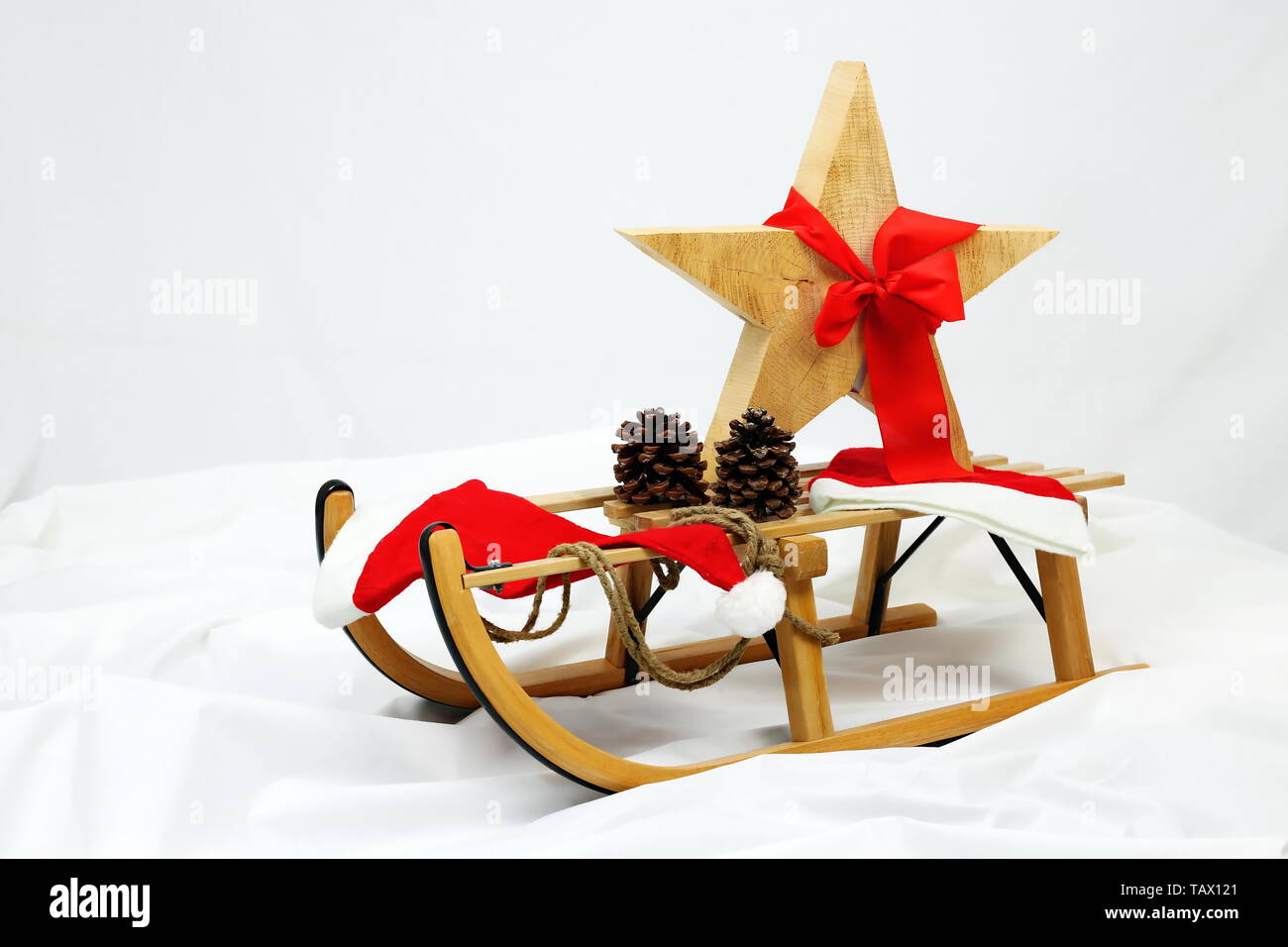 Christmas star decoration with red bow on a sledge Stock Photo