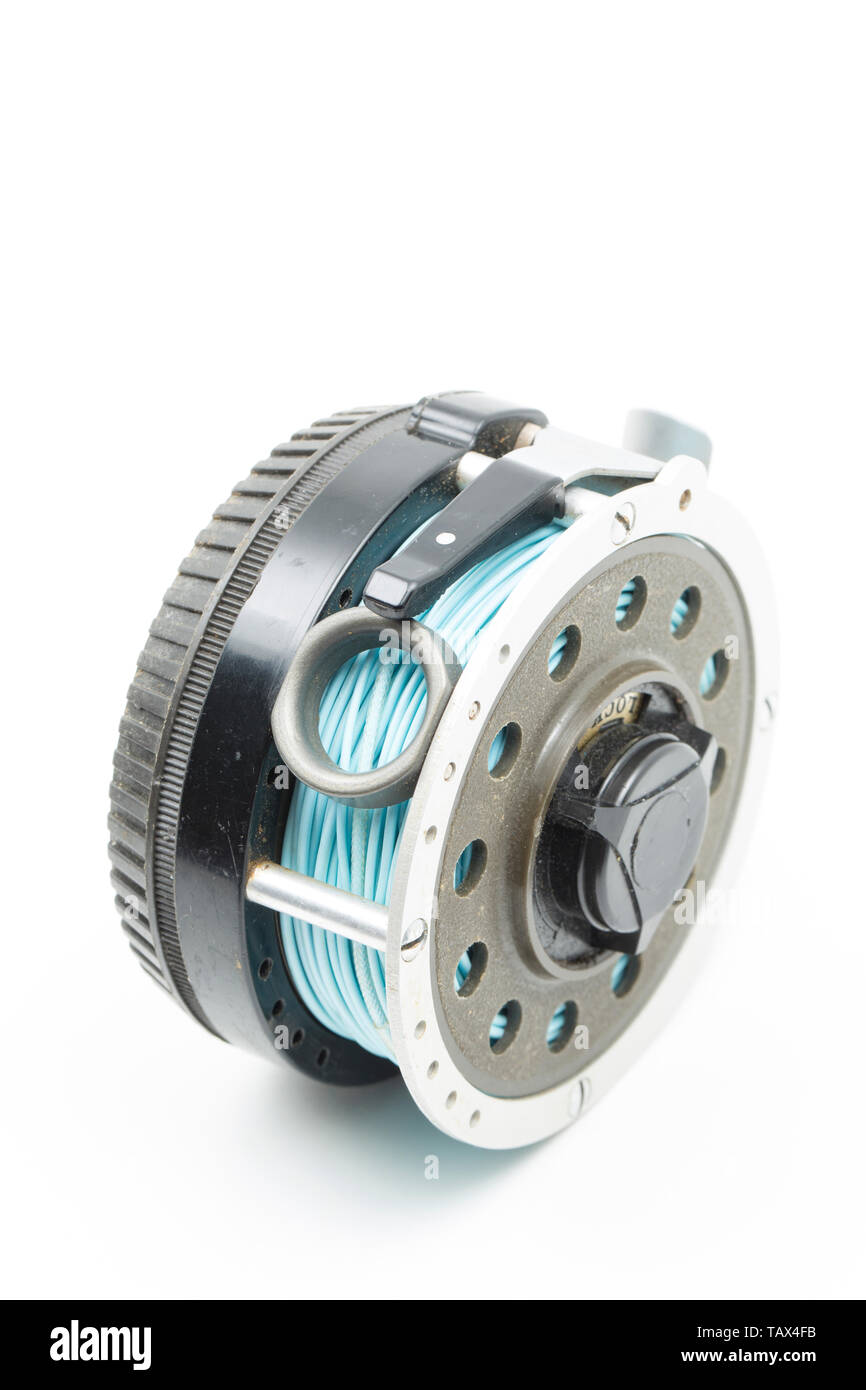 A Garcia Mitchell 710 Automatic Fly Reel produced in the 1970s. The reel worked on a clockwork principle, as the line was pulled from the spool it wou Stock Photo