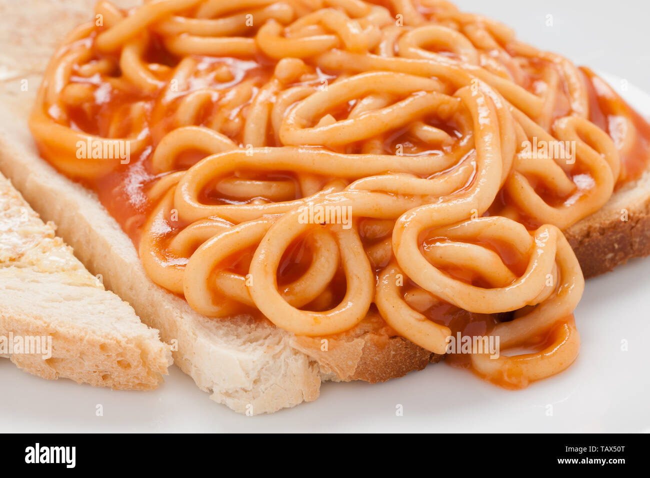 Canned spaghetti on toast a simple and quick meal for those on a budget Stock Photo