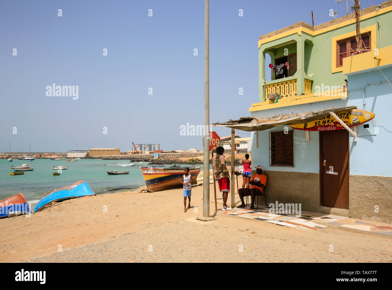 24.02.2019, Sal Rei, Boa Vista, Cape Verde Islands - Locals in front of their house at the old fishing port. 00X190224D138CAROEX.JPG [MODEL RELEASE: N Stock Photo