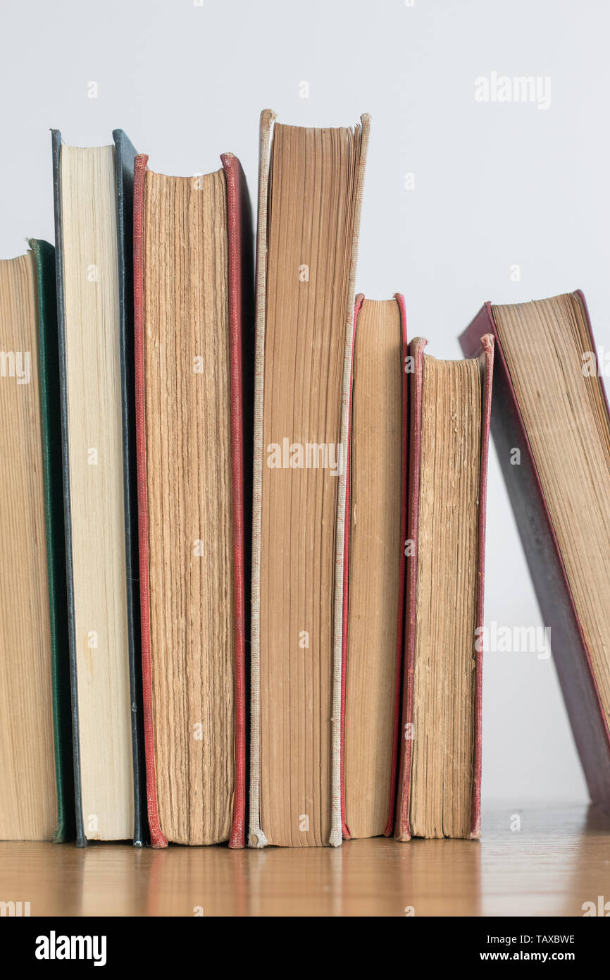 Old books on a book shelf Stock Photo