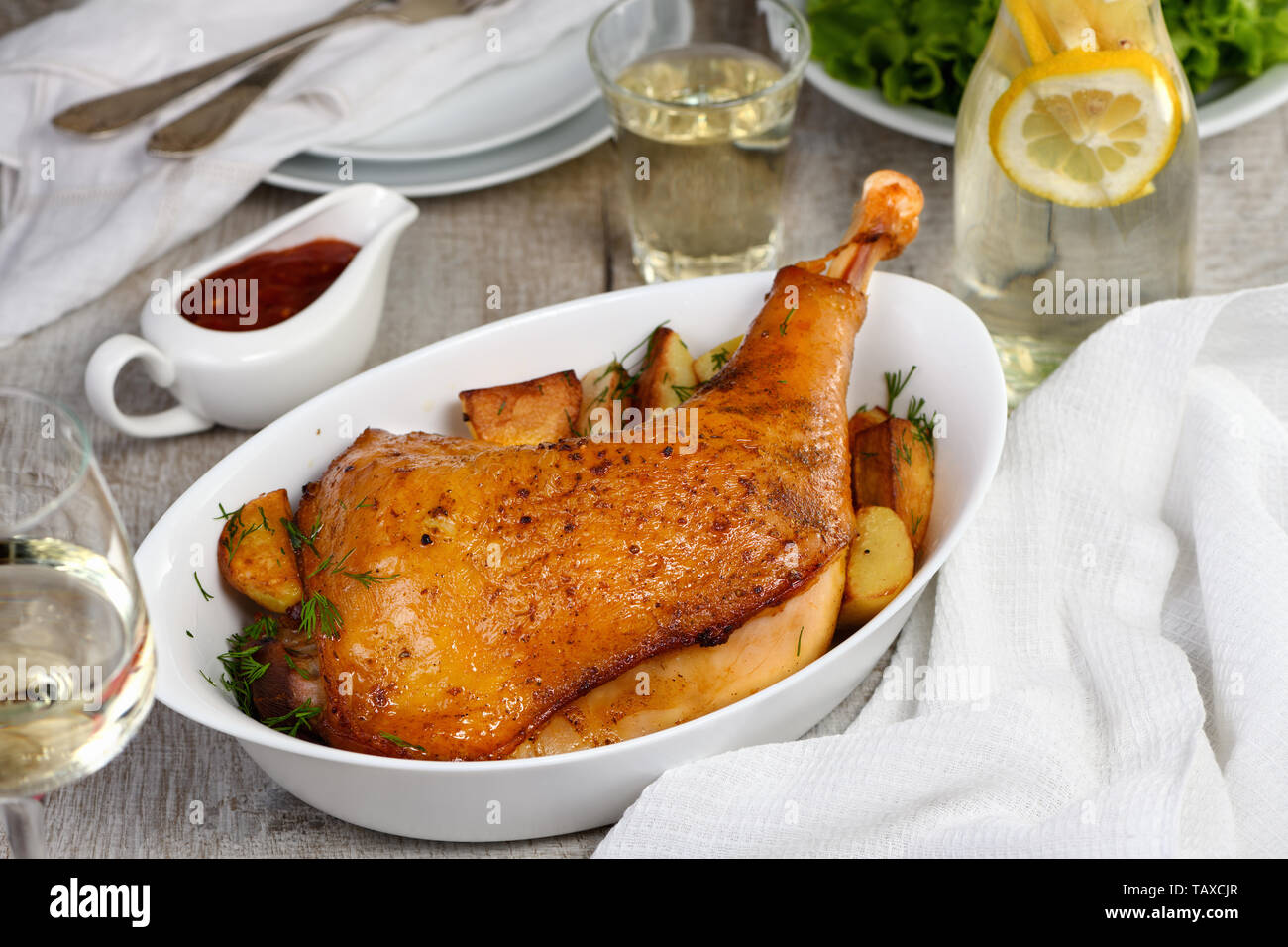 Roasted turkey leg with potatoes on the dinner table Stock Photo Alamy