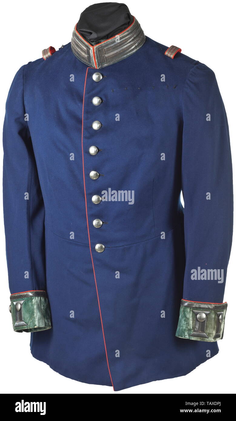 An officer's uniform jacket (military court counsel), Uniform jacket for a Württemberg military court counsel of fine dark blue cloth with red piping, circa 1900. The collar and cuffs with silver braid and green velvet lining, silver buttons, straps for epaulettes, loops for orders clasps. Tailor tag 'Deutscher Offizier-Verein, Berlin', dark green silk lining. Minimally used and in beautiful condition. Wuerttemberg, Wurttemberg, Württemberg, Southern Germany, the South of Germany, south german, object, objects, stills, clipping, clippings, cut ou, Additional-Rights-Clearance-Info-Not-Available Stock Photo