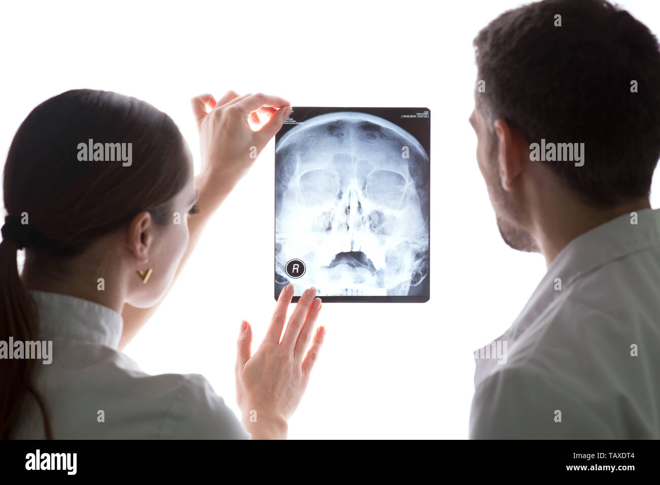 Two doctors discussing patients xray and MRI scans, Spine xrays Stock Photo Alamy