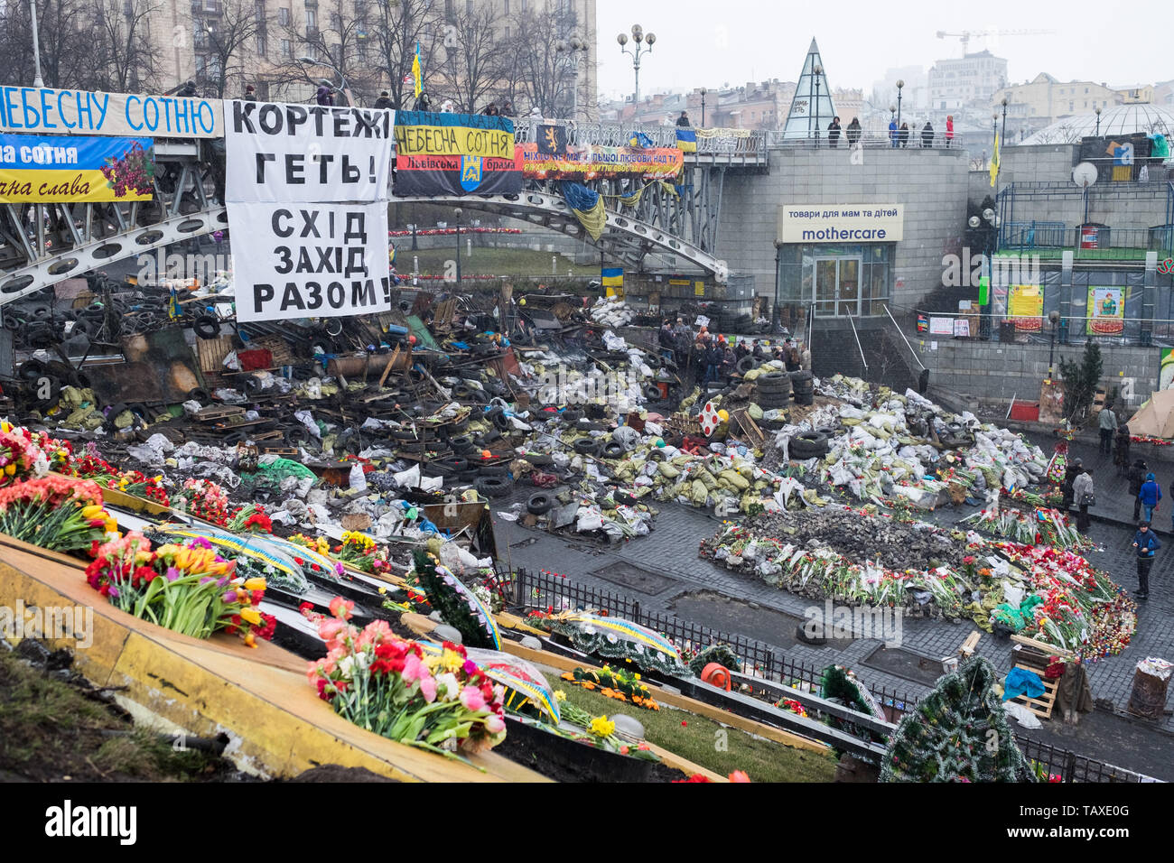 KIEV, UKRAINE - January 25, 2014: Mass anti-government protests in the center of Kiev. Barricades in the conflict zone on Hrushevskoho St. Stock Photo