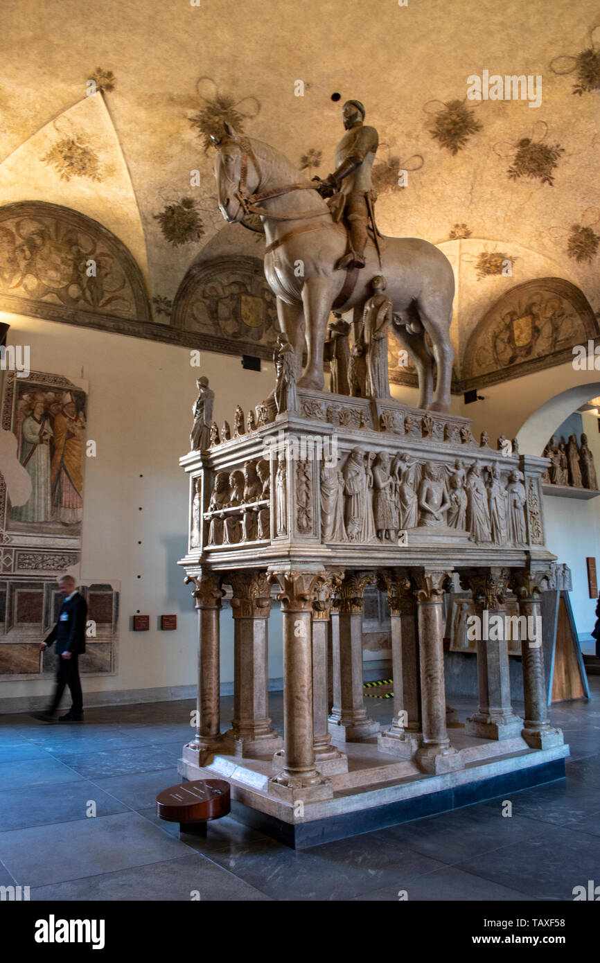 Milan, Museum of ancient art, Sforza Castle: Equestrian monument to Bernabò Visconti, marble statue by Bonino da Campione above the Lord sarcophagus Stock Photo