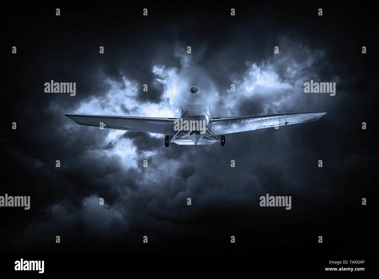 Old plane in a cloudy sky Stock Photo - Alamy