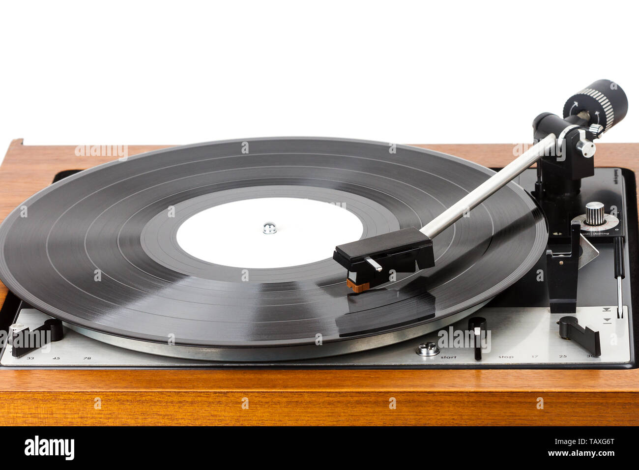Vintage turntable vinyl record player isolated on white. Wooden plinth ...