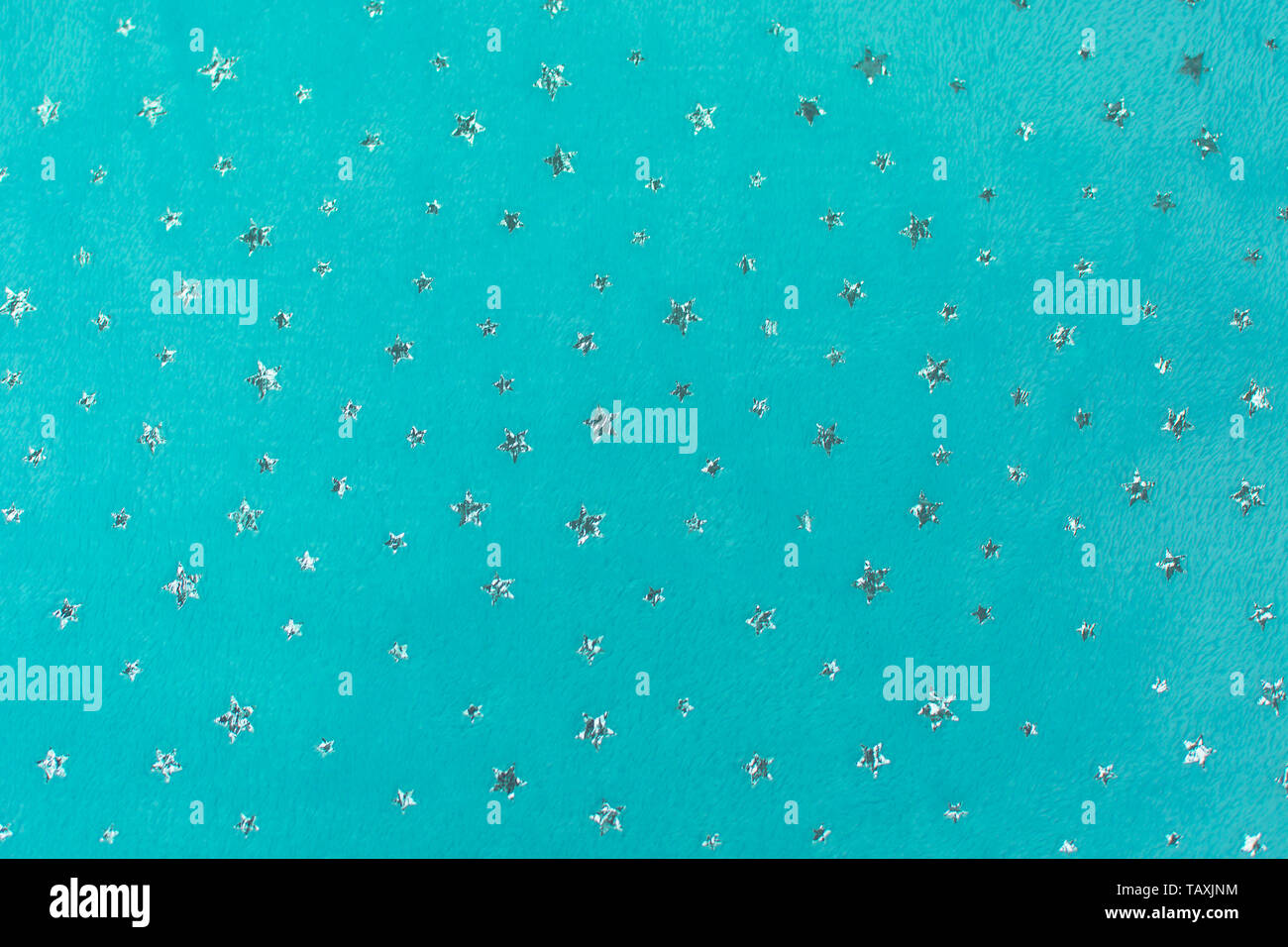 Fluffy Gentle baby aquamarine color fabric with silver stars. Soft pastel textile texture. Towel terry cloth. Stock Photo
