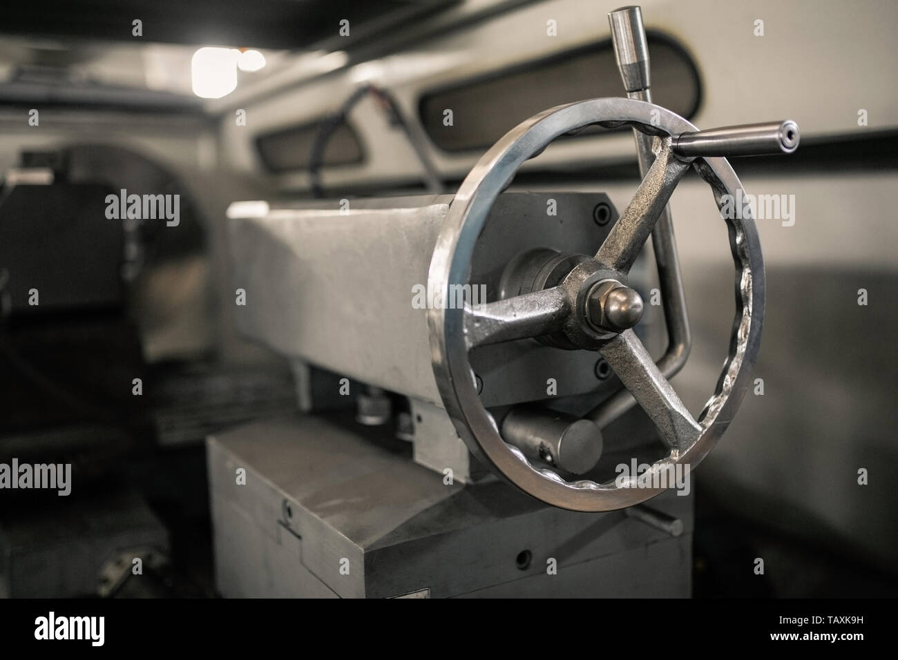 Tailstock of the lathe machine. Handle clamp on a metalworking lathe
