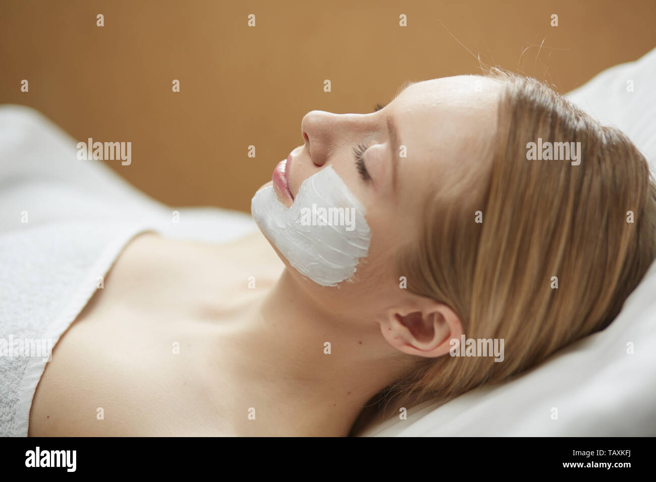 Beautiful young woman in cosmetic salon close up Stock Photo
