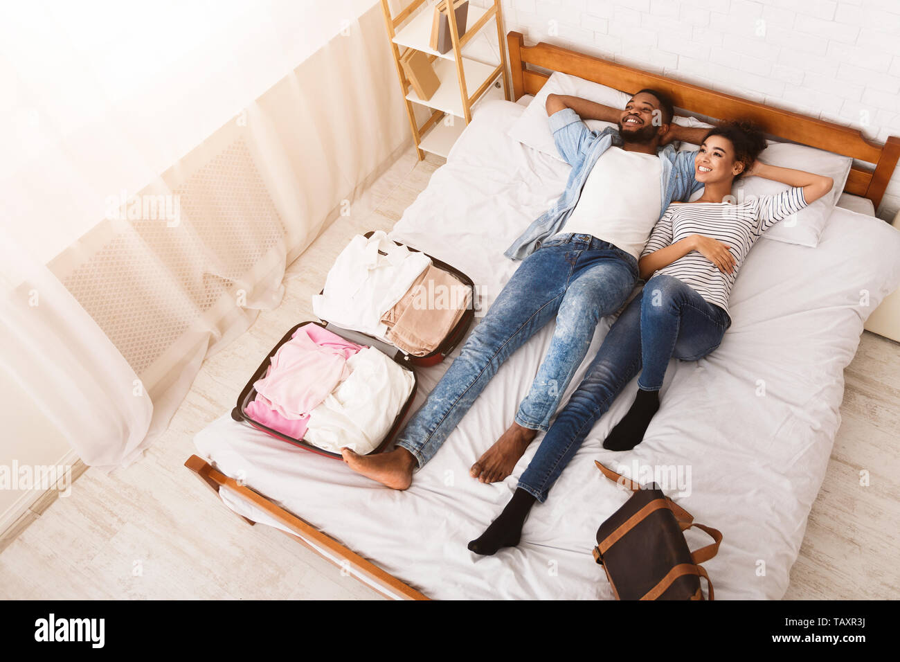 Couple lying together on bed hi-res stock photography and images - Alamy