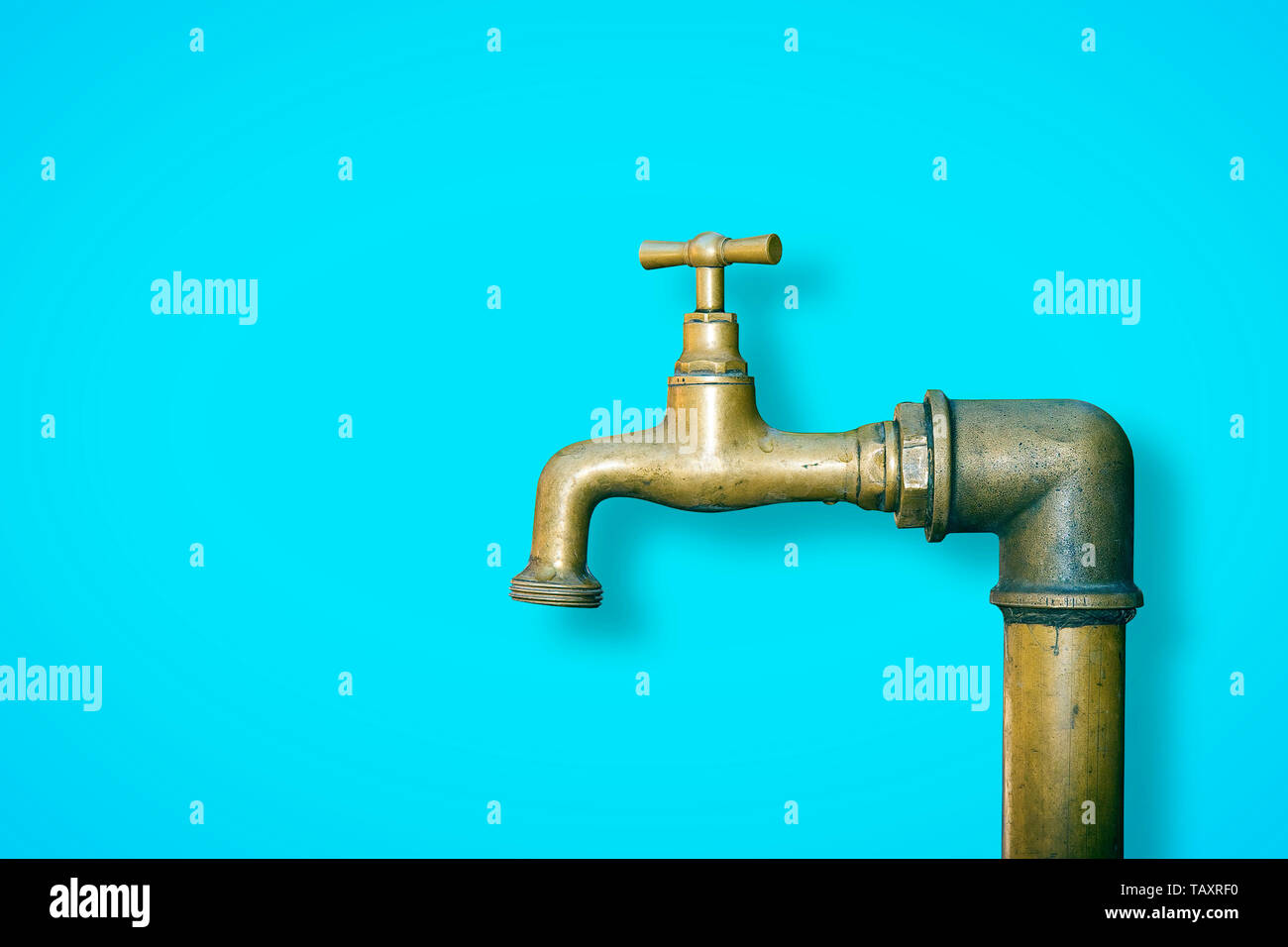Detail of a water brass faucet isolated on solid color background