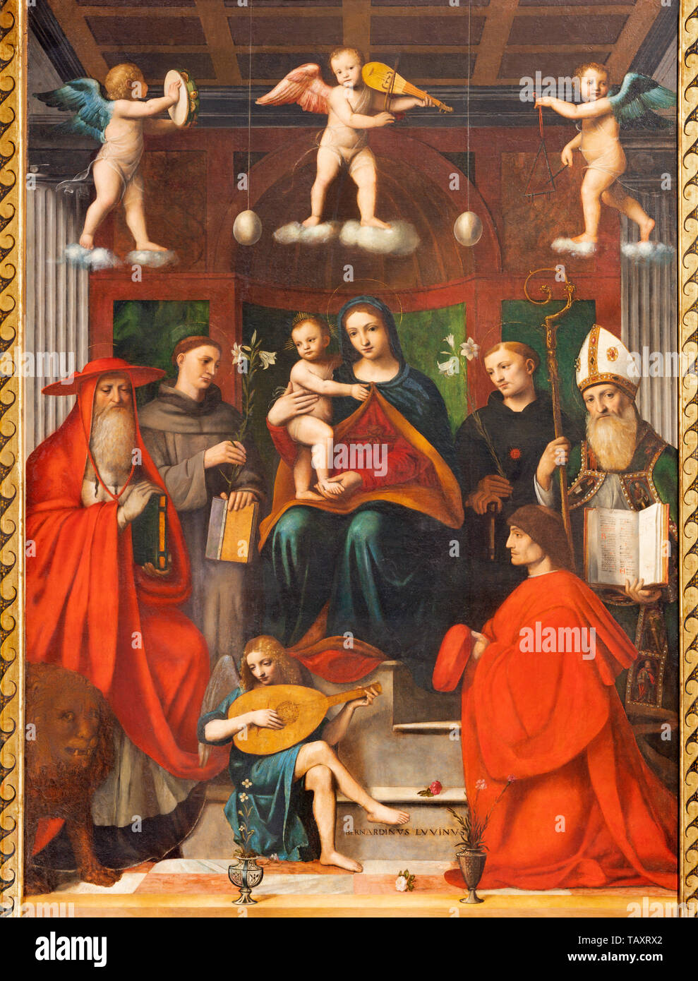 COMO, ITALY - MAY 8, 2015: The painting Madonna among the saints - Sacra Conversazione in Duomo by Bernardino Luini (1481- 1532). Stock Photo