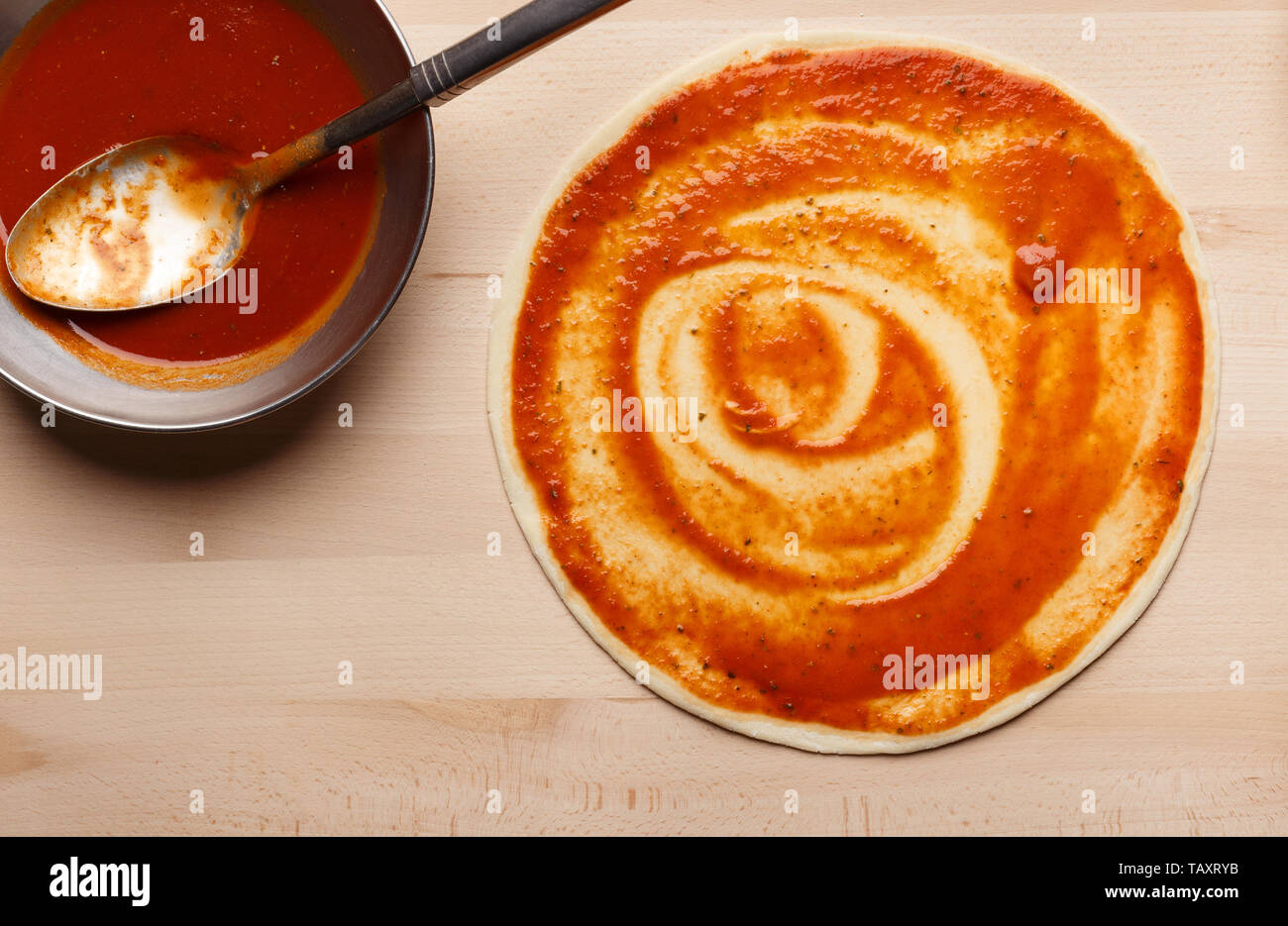 Pizza Preparation. Raw Pizza Base With Ketchup Stock Photo Alamy