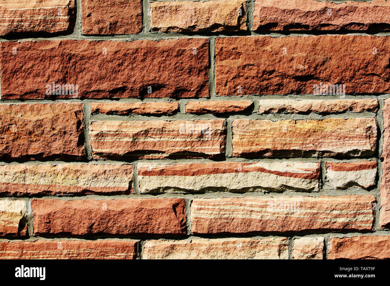 Texture background of a red sandstone wall. Stock Photo