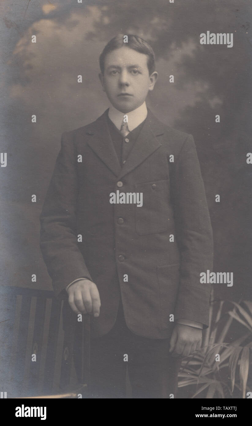 Vintage 1906 Newport, Monmouthshire Photographic Studio Postcard Showing a Welsh Boy Called Frank James Little. Known as Jim. Wearing a Suit, Shirt and Tie. Stock Photo