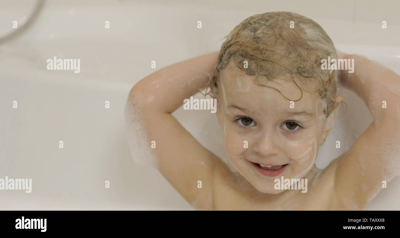 Attractive Three Years Old Girl Takes A Bath Wet Hair With Bath