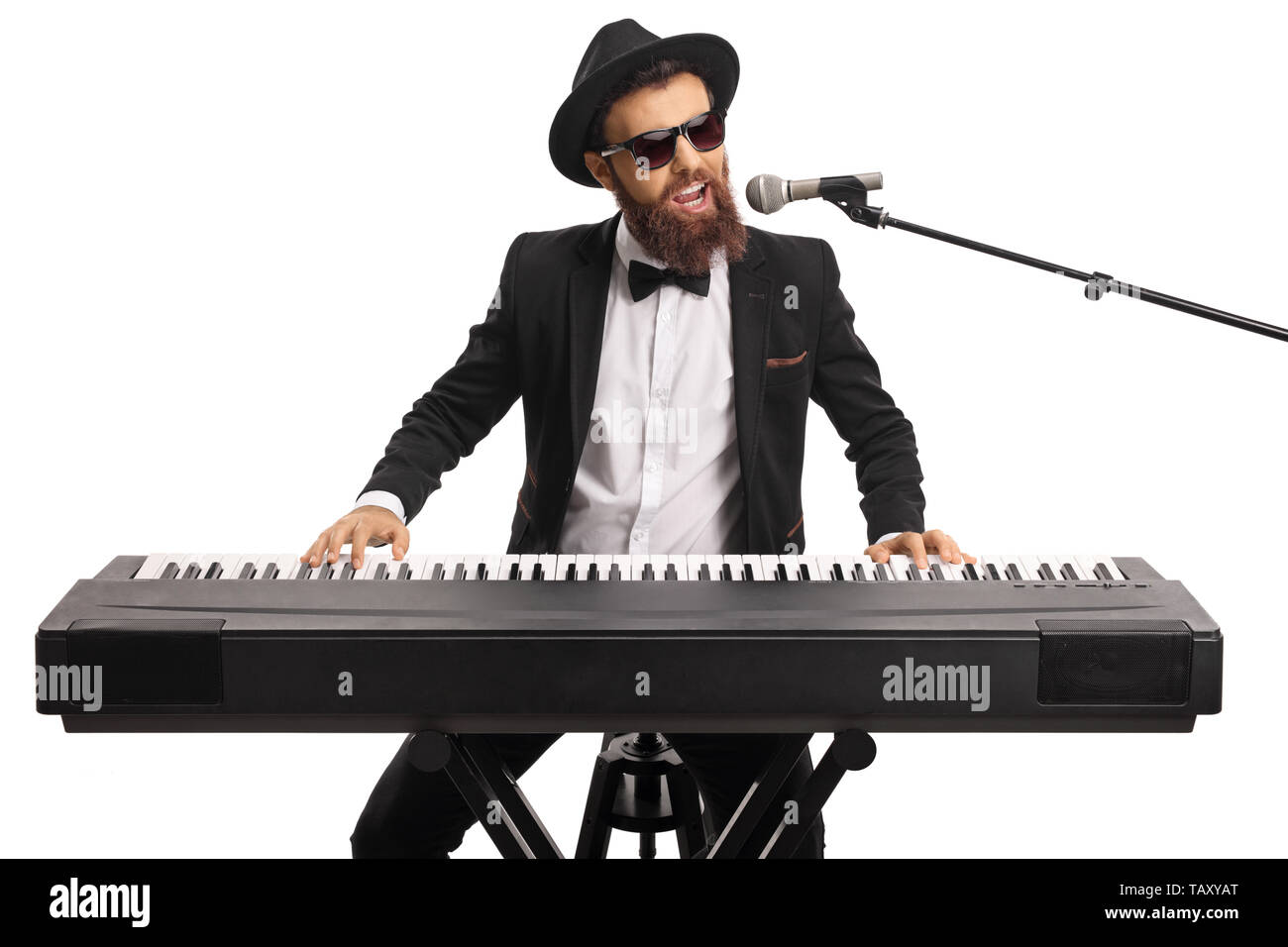 Man with sunglasses and a beard playing a digital piano and singing on a  microphone isolated on white background Stock Photo - Alamy