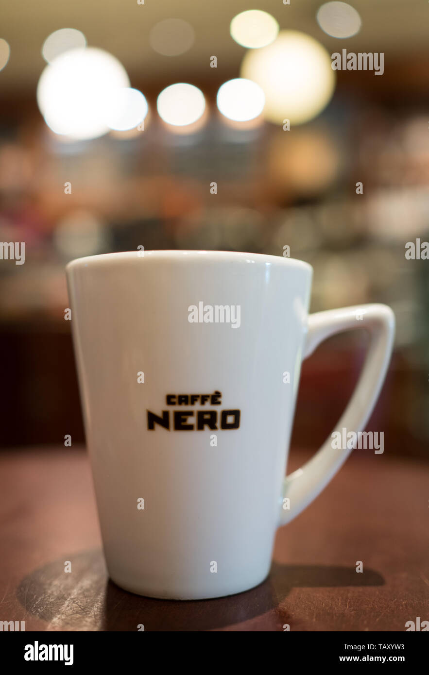 Mug of cappuccino at Caffe Nero in Waterstones Bournemouth with bokeh Stock Photo