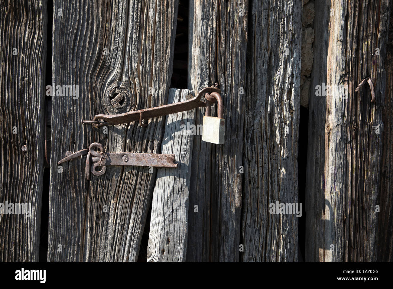 Old rusty vintage lock on a wooden door Stock Photo - Alamy