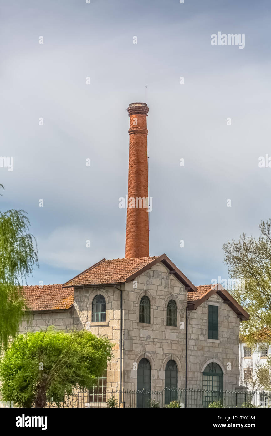Viseu / Portugal - 04 16 2019 : View of the Museum of electricity, top building with chimney in industrial brick, in the enclosure of the market of Sã Stock Photo