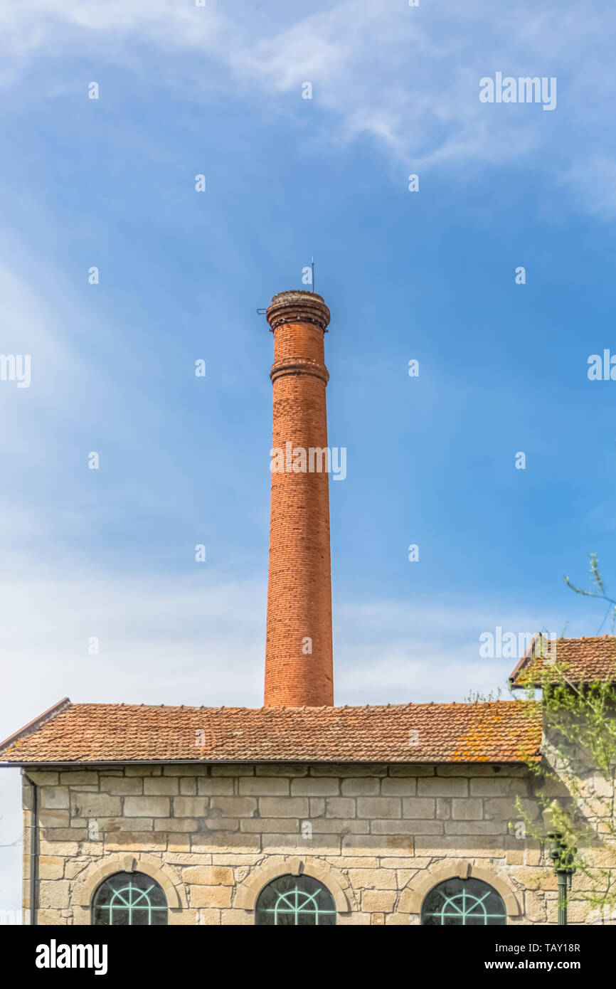 Viseu / Portugal - 04 16 2019 : View of the Museum of electricity, top building with chimney in industrial brick, Portugal Stock Photo