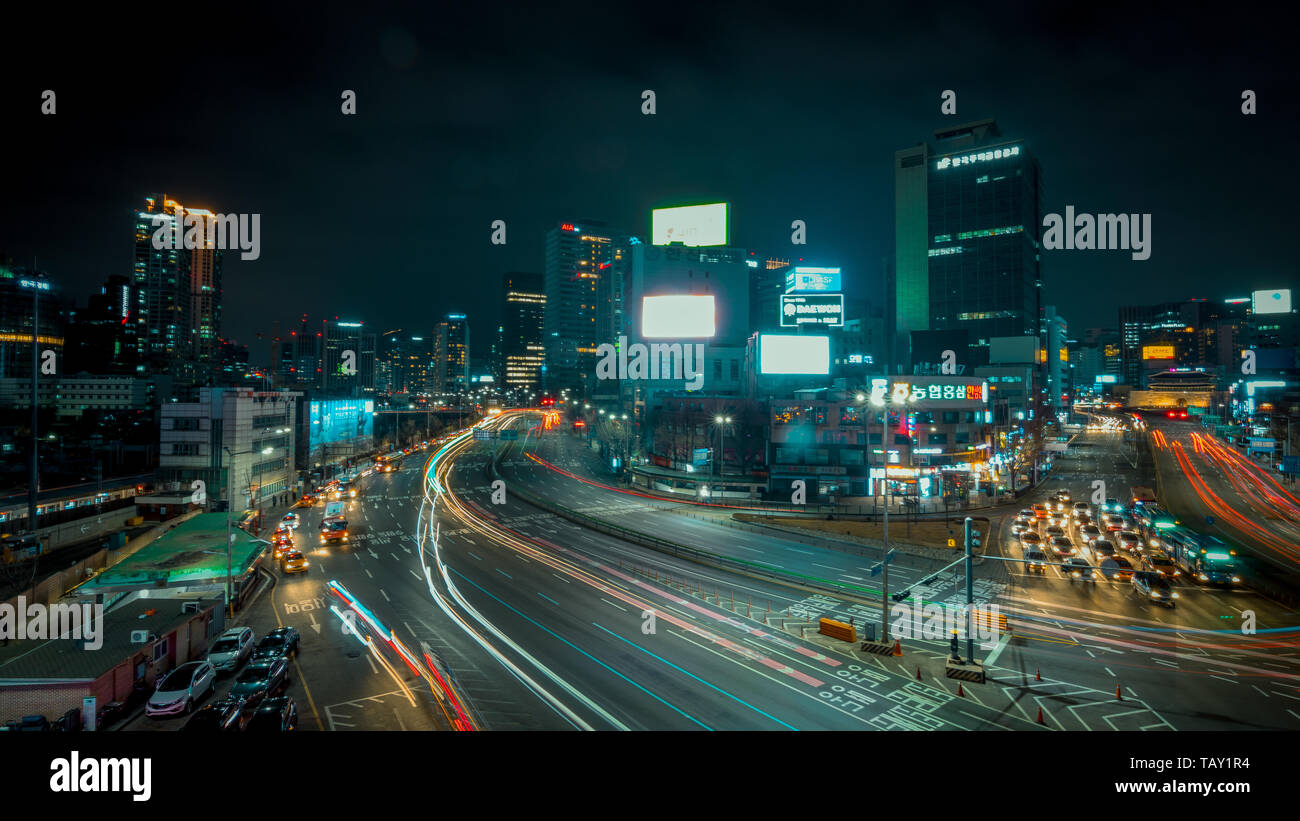 Seoul, South Korea - March 2018: long exposure of an urban landscape that incorporates moving cars and illuminated buildings Stock Photo