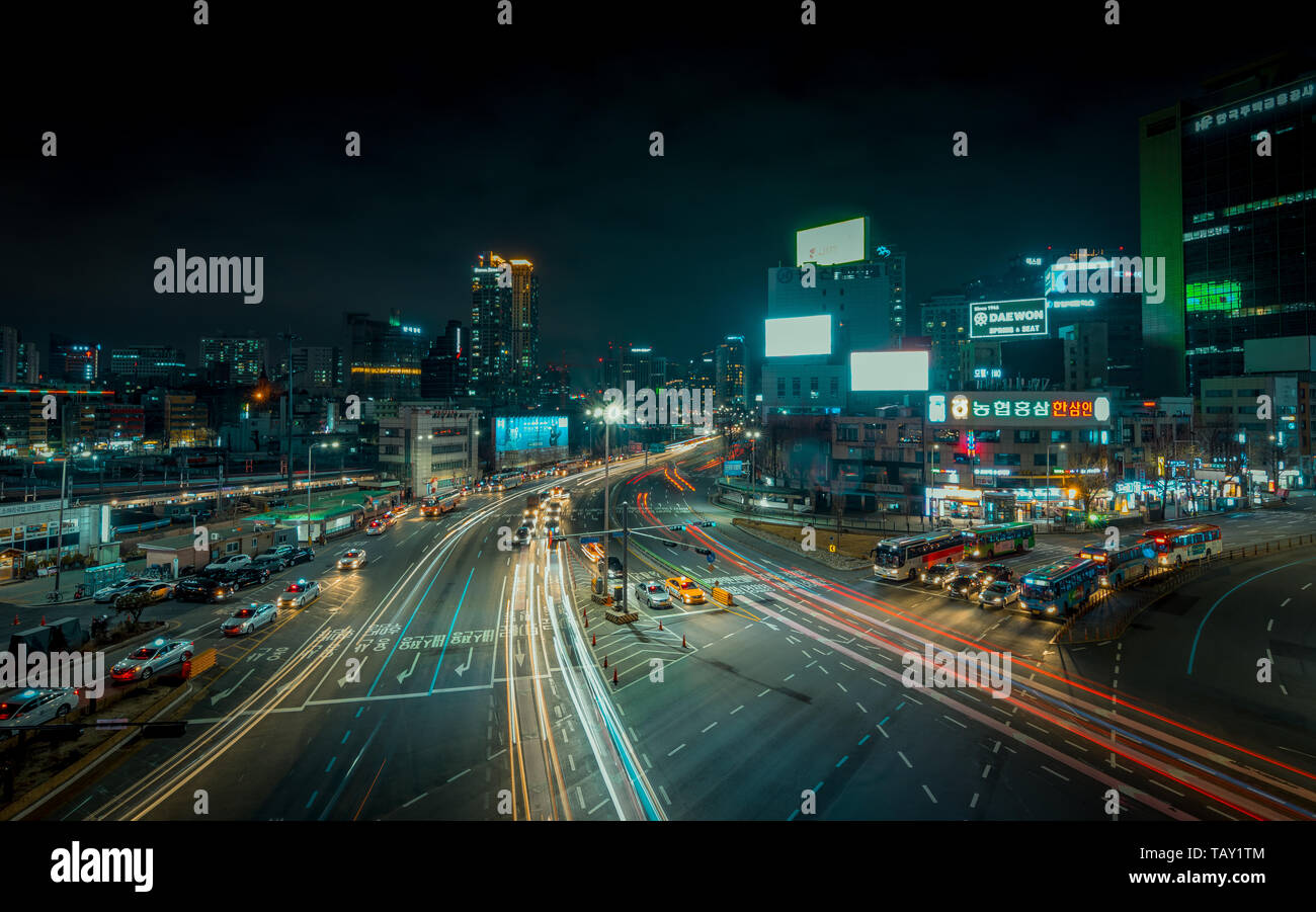 Seoul, South Korea - March 2018: long exposure of an urban landscape that incorporates moving cars and illuminated buildings. Stock Photo