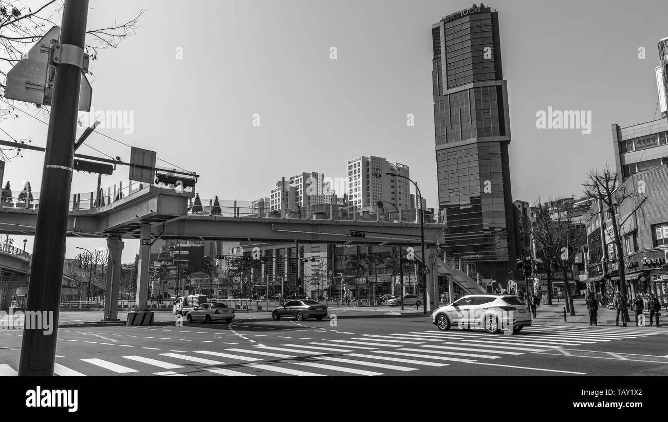 Seoul, South Korea - March 2018: typical area of the city where you can see a skyscraper, signs, traffic roads and the Seoullo pedestrian bridge. Stock Photo