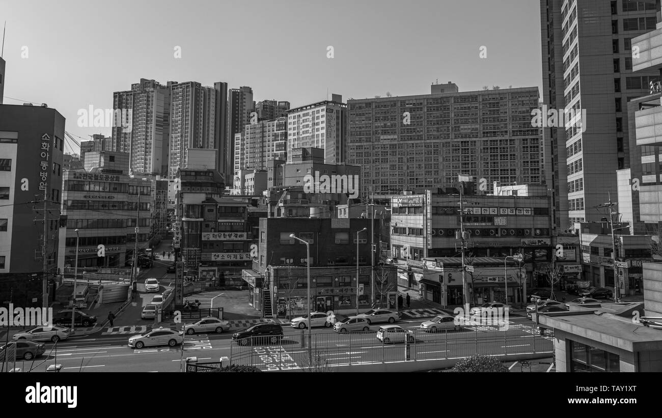 Seoul, South Korea - March 2018: typical area of the city where you can see buildings with signs and roads with traffic on a beautiful day. Stock Photo