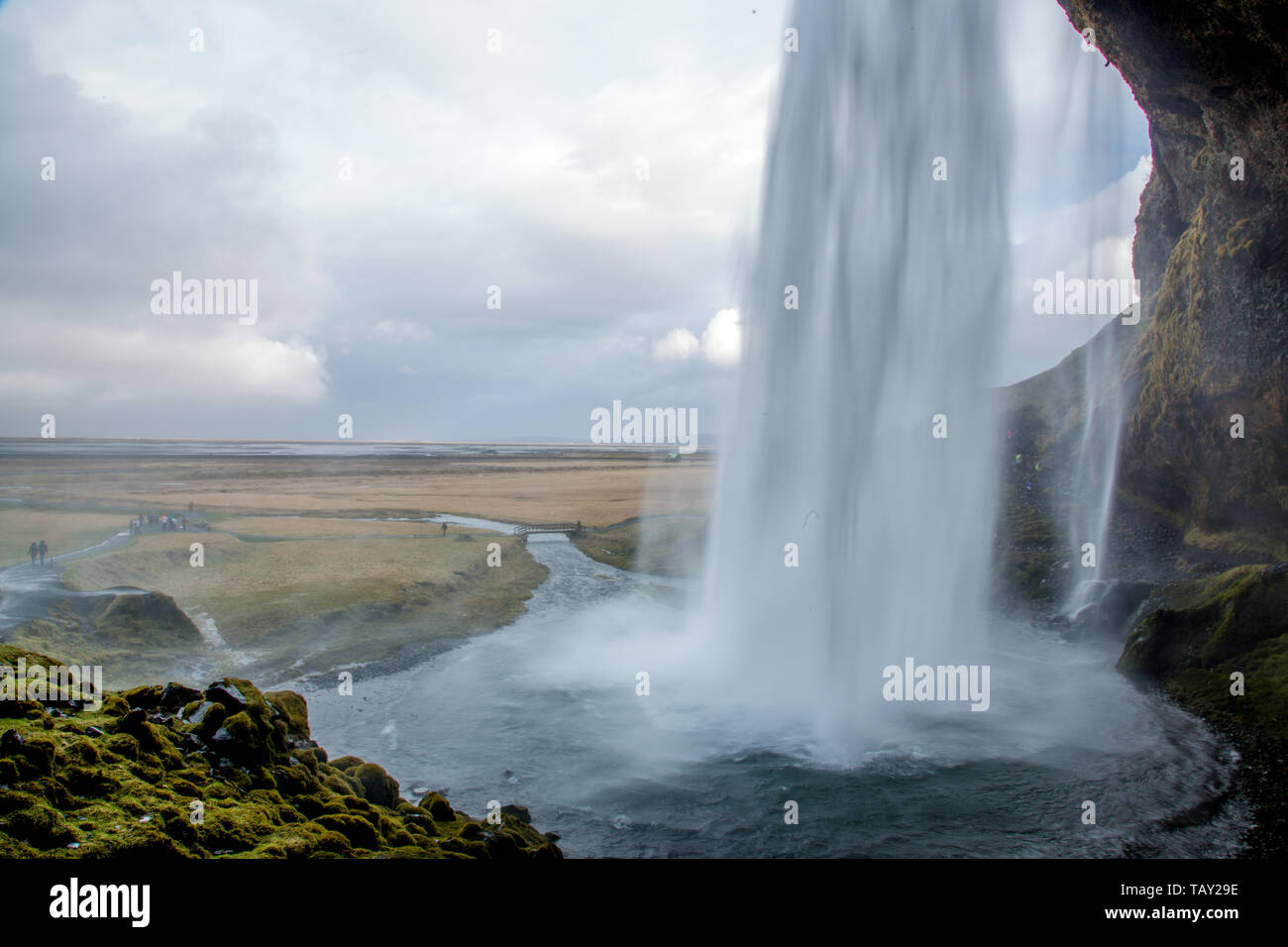 Back of a waterfall out of cave - Seljalandsfoss in Iceland Stock Photo