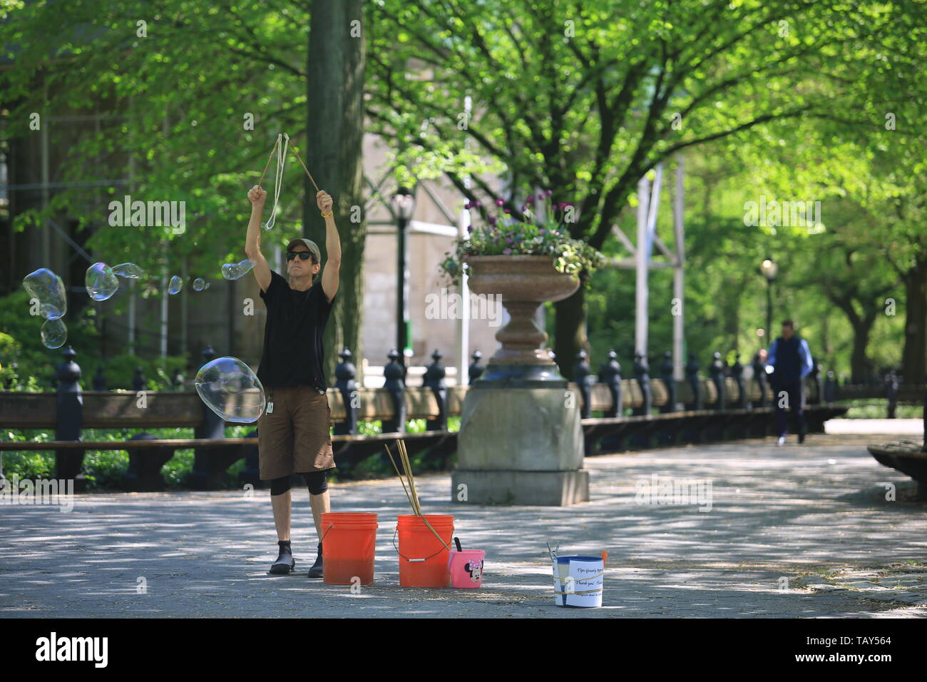 the performance art from the actor playing the bubble in central park Stock Photo