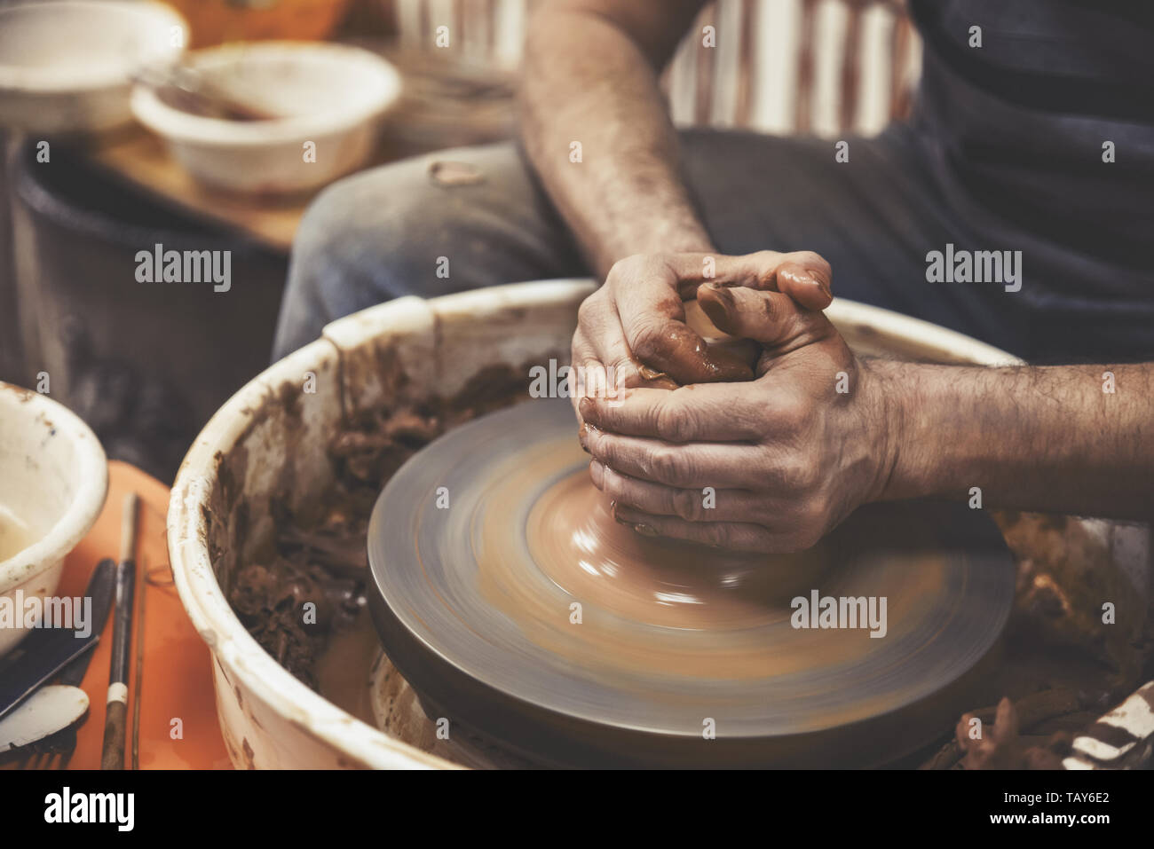 A day in the life of a pottery artist at the pottery wheel Stock