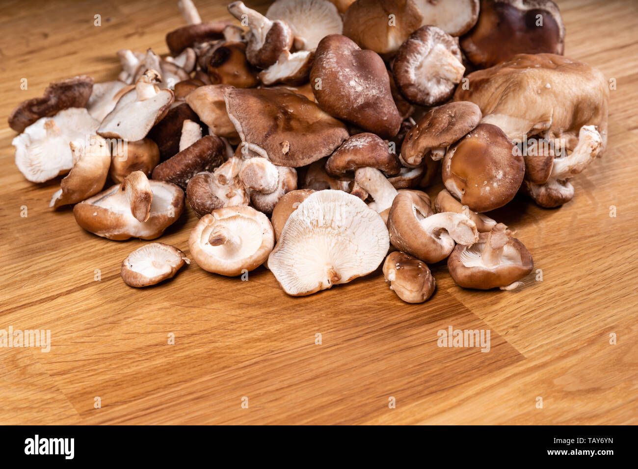 Fresh Cremini mushrooms ready for preparation on a table Stock Photo