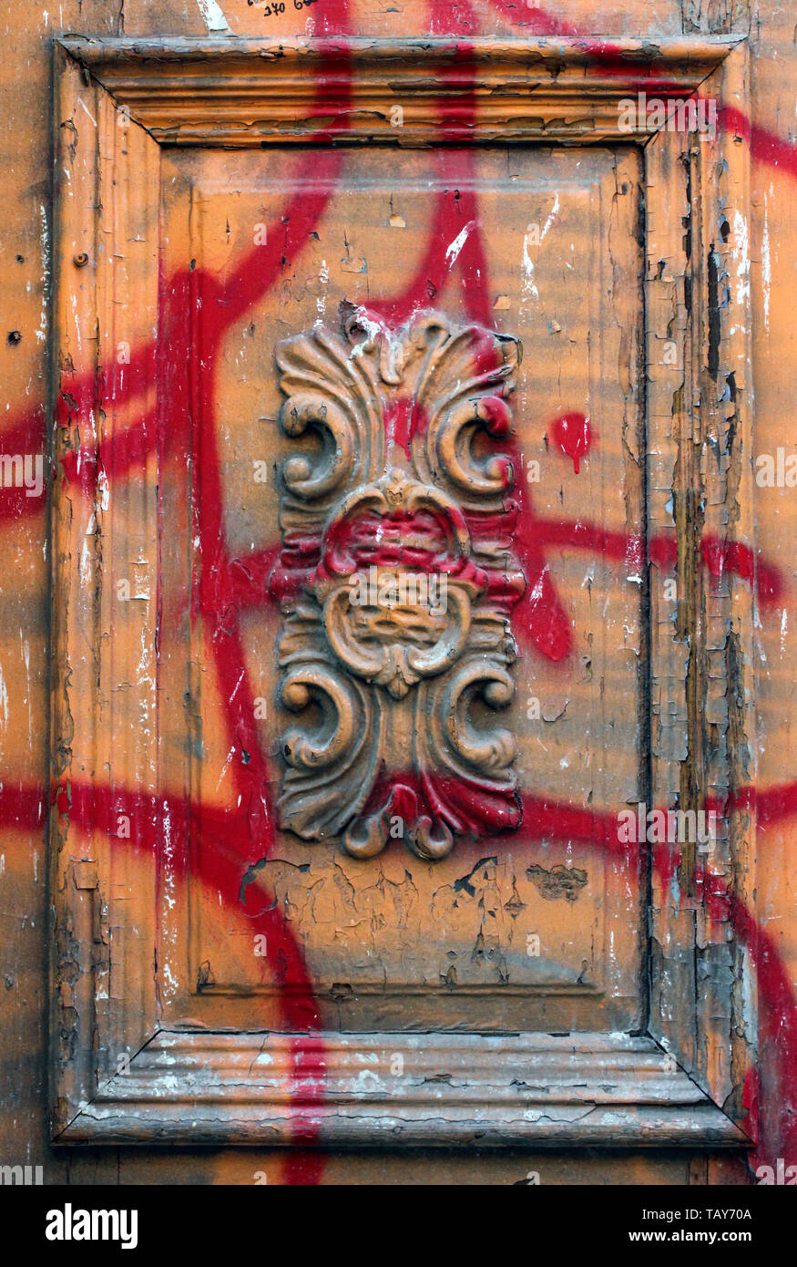Deliberate damage to a beautiful carved door in Prague, Czech Republic Stock Photo