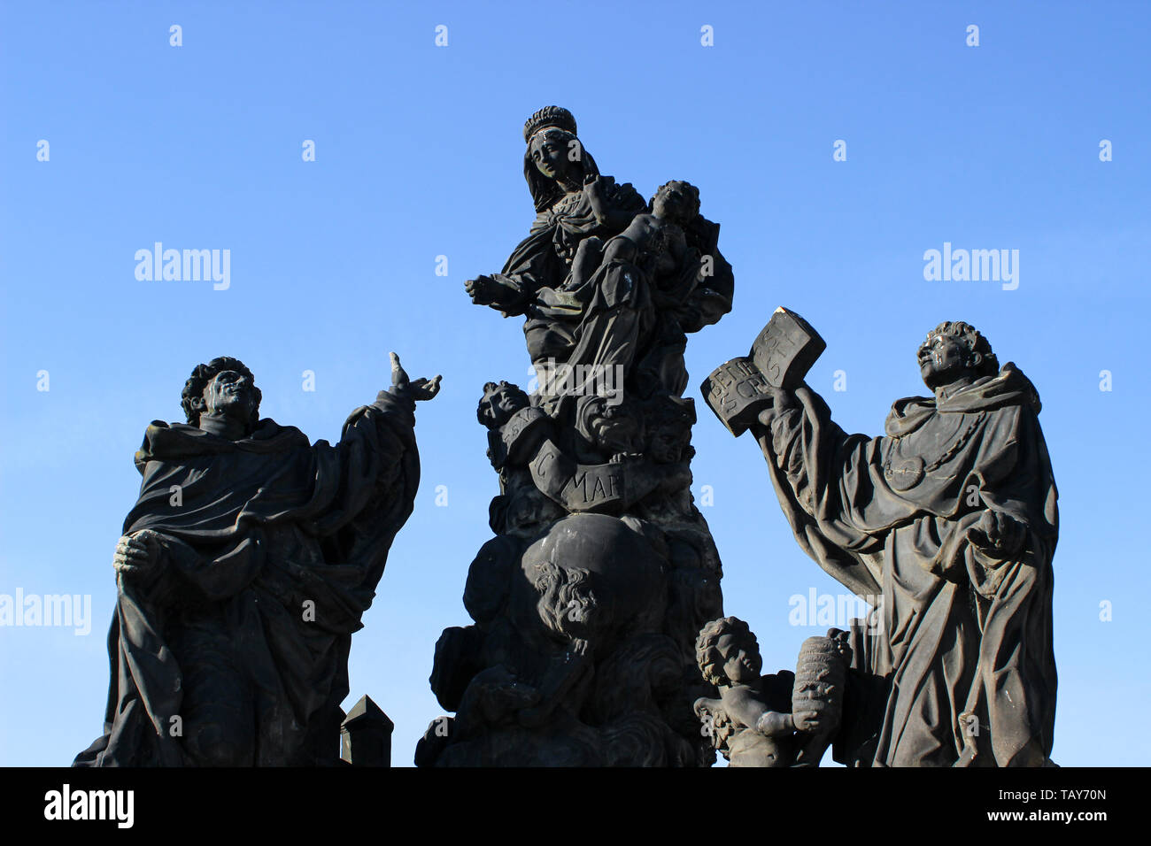 Statue of the Madonna attending to St. Bernard on Charles Bridge in Prague, Czech Republic Stock Photo