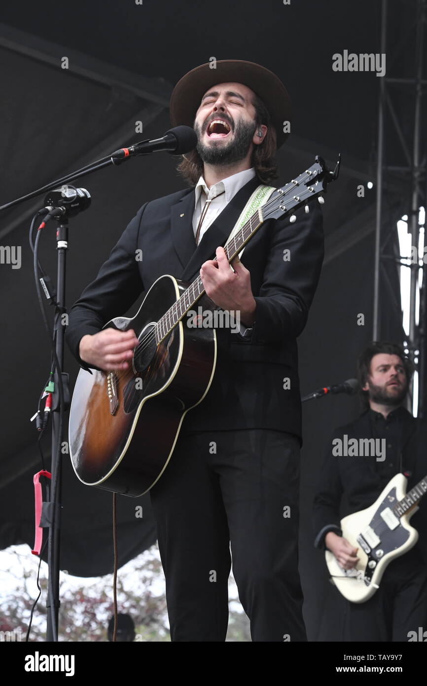Singer, songwriter and guitarist Ben Schneider is shown performing on stage during a "live" stand up concert appearance with Lord Huron. Stock Photo